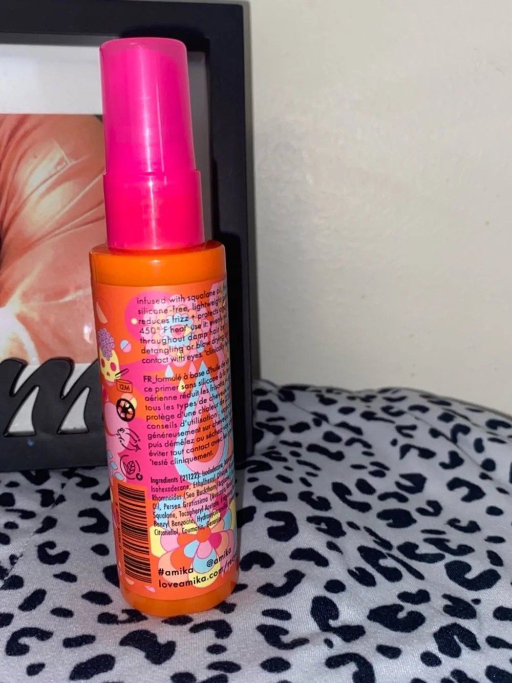 amika Bright Orange Bottle with Pink Cap Detangling Primer
